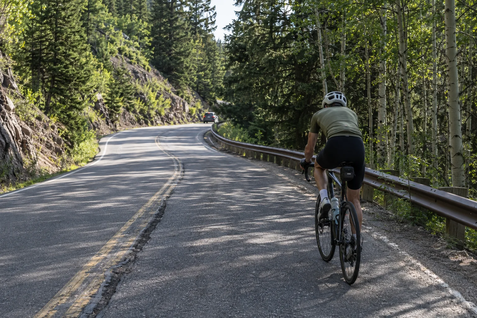 AI-generated editorial road-cycling scene inspired by Independence Pass near Aspen